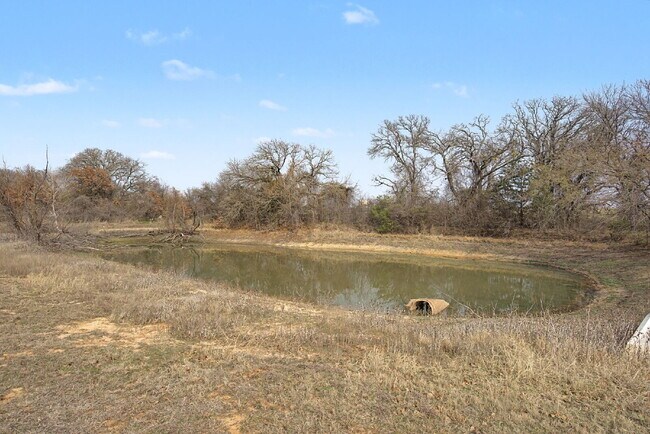 Building Photo - “4-Bedroom, 3-Bath Farmhouse Charm Meets Modern Luxury on a Serene 5-Acre Lot!”