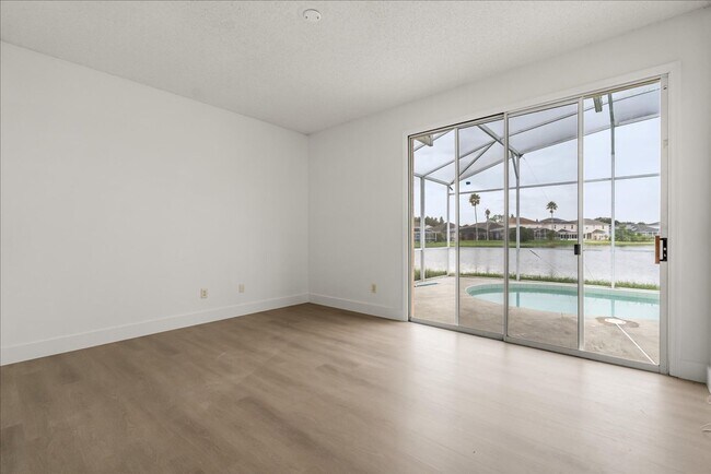 Building Photo - Stunning 4-Bedroom Lakefront Pool Home in Bridgeview at Meadow Woods