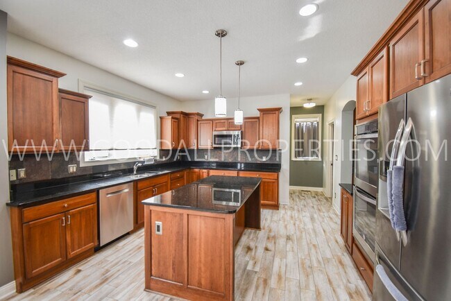 Building Photo - 4 Bedroom 4 Bath Executive Home in West Des Moines with a fenced in yard and a 3-car garage