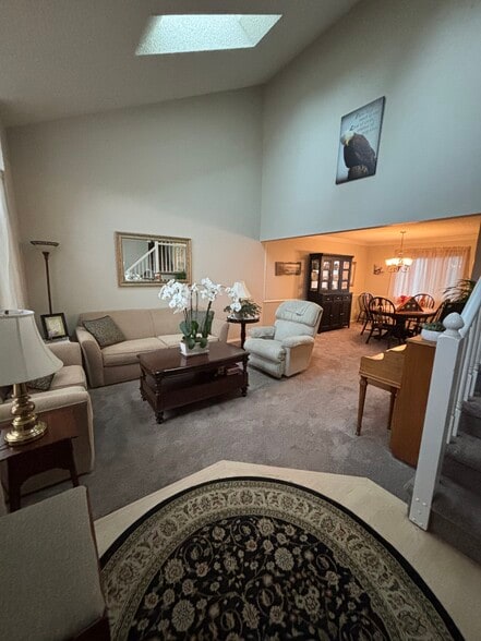 Spacious living room with skylights - 3425 Birnamwood Dr