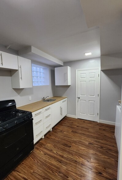 Kitchen leads to utility room 2 - 7302 Columbia Ave