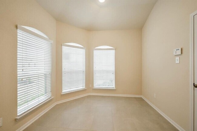 Building Photo - Beautiful stone front 4 bedroom, 3 bath home has bay windows in breakfast nook & master. It is on...