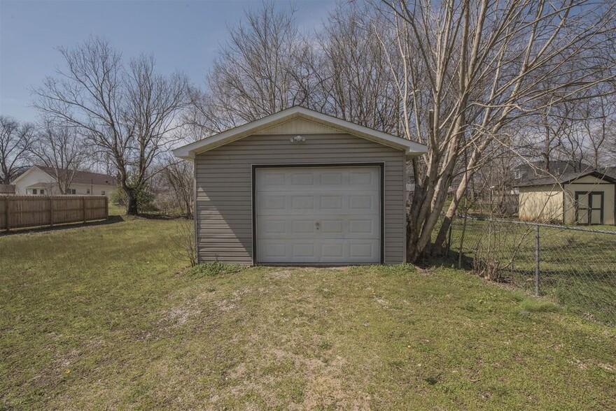 Single car garage with automatic garage door opener for parking and storage. - 725 North Academy Street