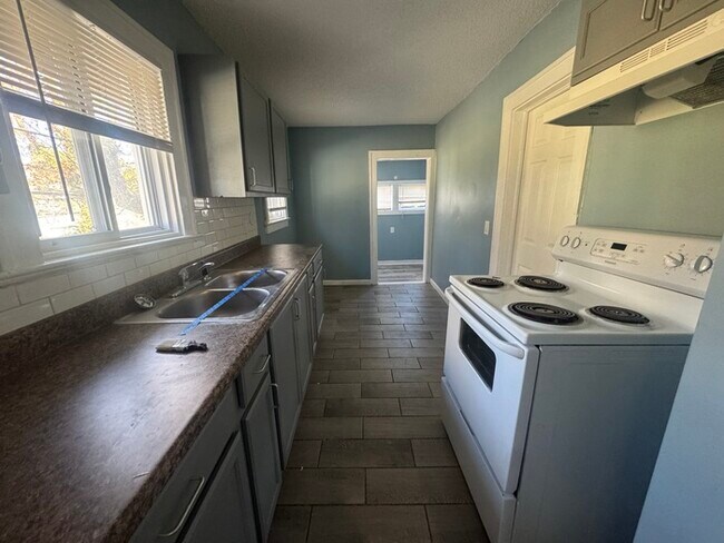 Building Photo - Charming 3BR 2BA Home w/ Fenced Yard + Covered Porch in KC