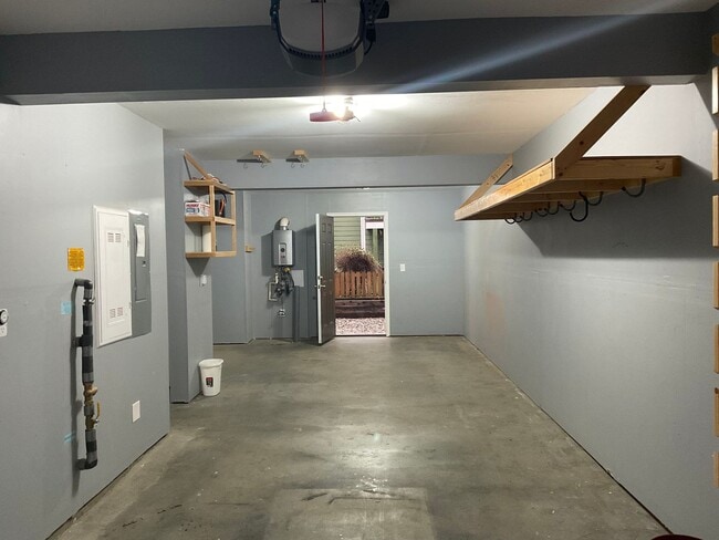 Building Photo - Riverfront Townhome with Tandem Garage & Fenced Yard