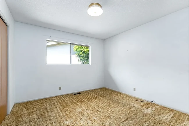 View of Bedroom 2 before new floors - 679 Rancho Dr