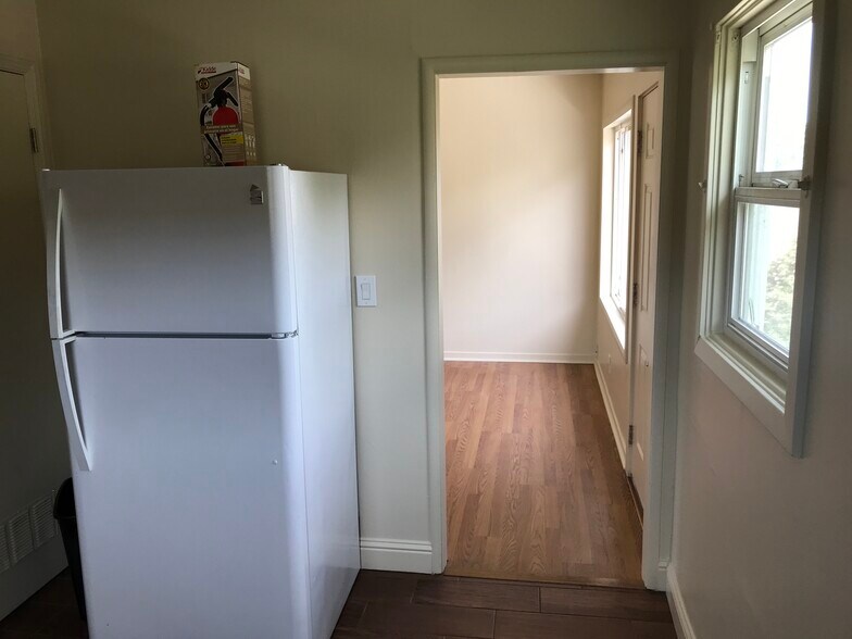 Kitchen into living room - 124 Lewelling Blvd