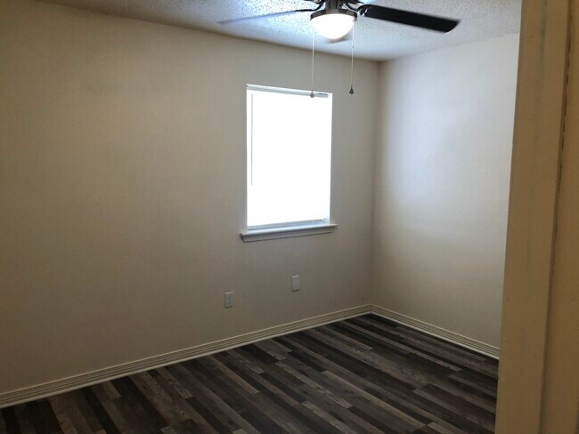 Bedroom 2 - new flooring, fixtures, and paint - 1057 Tallow Tree Ln