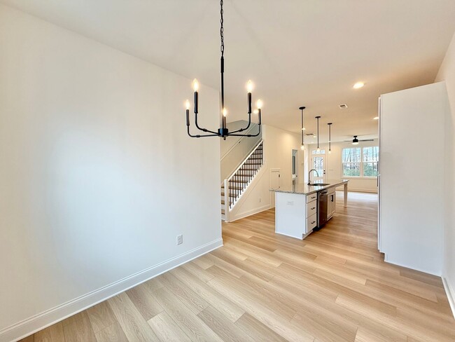 Building Photo - **OFFERING 1/2 OFF FIRST MONTH'S RENT** Newly Built 4BD, 3.5BA End-Unit Raleigh Townhome in a Gre...