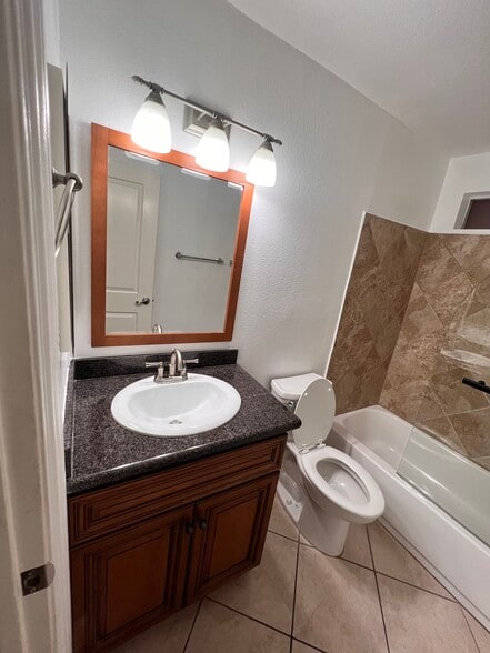 Guest Bathroom (View with Sink, Mirror and toliet) - 2507 E 15th St