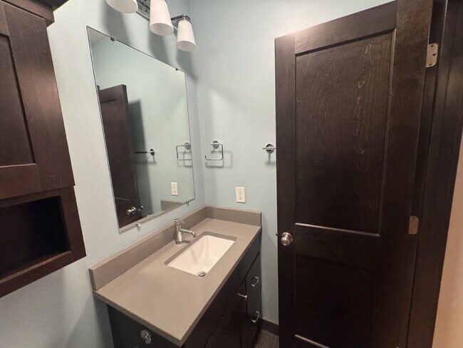 Building Photo - "Charming Studio Retreat with Hardwood Elegance in Downtown Minneapolis!"