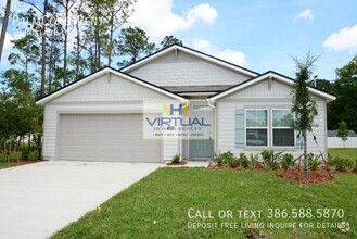 Building Photo - "Spacious 4-Bedroom Gem in Palm Coast – Yo...