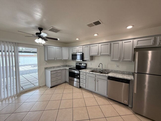 Building Photo - 4 Bedroom Home with Large Backyard | Modern Landscaping | Utilities Included