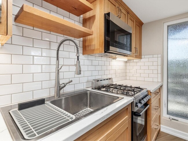 Building Photo - Studio with Loft, Private Patio, and All U...