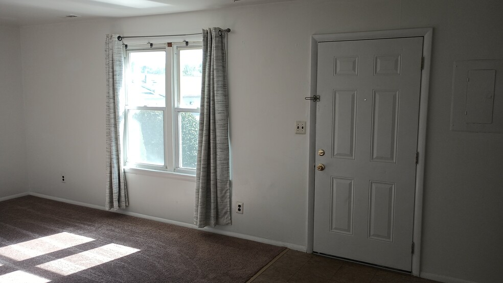 Living room whowing entry door - 1331 N Black Horse Pike