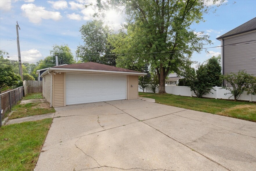 2 car garage with back workshop and/or storage room in the back. - 9244 Northern Ave