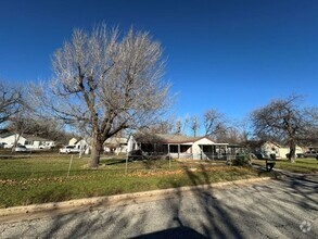 Building Photo - 3 bed 2 bath 1 car carport, new paint, woo...