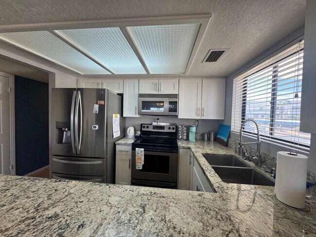 Building Photo - FURNISHED 2BR CONDO w/Utilities Water View Gated NO STAIRS