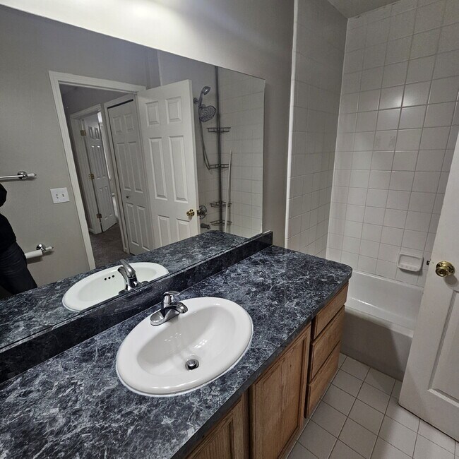 Building Photo - 2 Bedroom, 1.5 Bath Townhouse w/ Garage & Huge Master Bedroom. Full Sized Washer & Dryer In Unit.