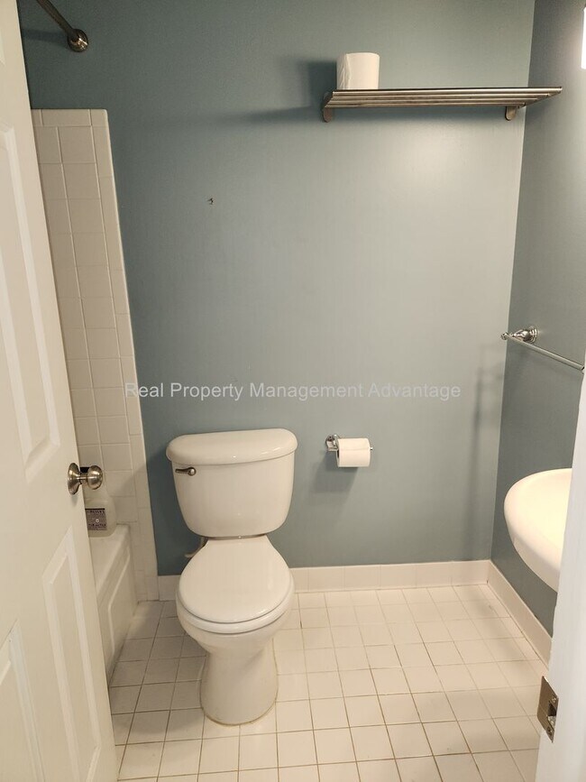 Building Photo - Spacious, Updated Condominium with Two Ful...