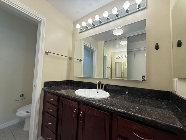 Building Photo - Upgraded Condo with Private Patio, AC, Pool, Gym, and Covered Parking in Gated Community