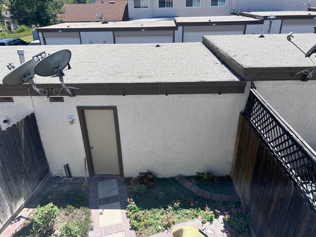 View of large backyard and access door to private garage - 2356 Canyon Park Dr