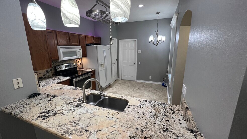 Kitchen From Dining Room - 4219 Key Thatch Dr
