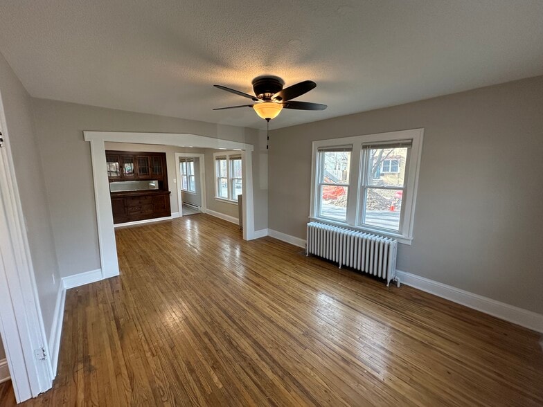 Living room looking into the dining room - 235 Logan Ave N