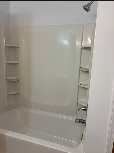 New tub and surround - 5018 W 5th Pl