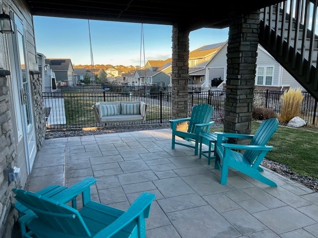 Covered patio with outdoor furniture and swing (included) - 28011 E Otero Pl