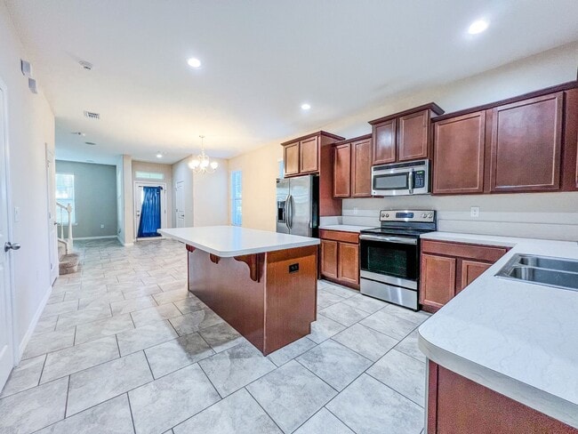 Building Photo - Spacious 4-Bedroom Townhome in Harmony – A Perfect Blend of Nature & Comfort!