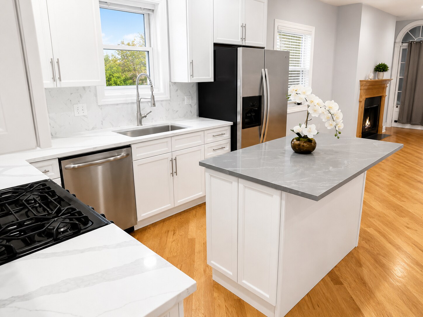 Updated white shaker kitchen with stainless steel appliances and quartz countertops - 3513 North Reta Avenue