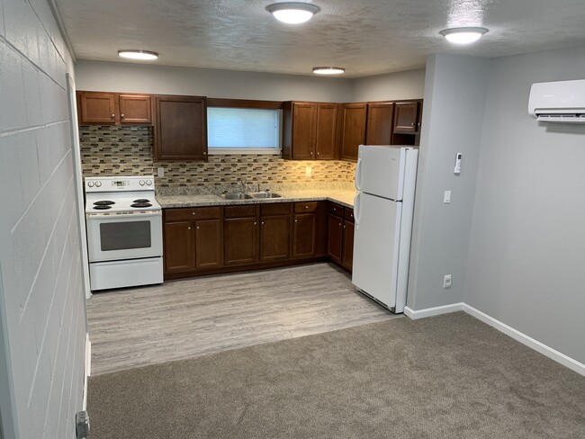 Kitchen with refigerator & stove - 705 Peach Tree Ln