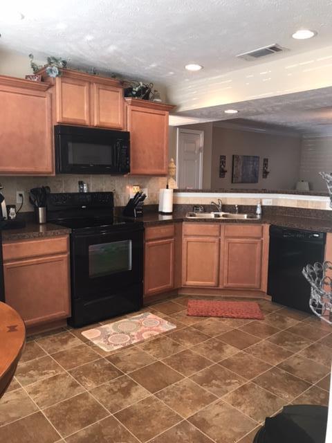 Open kitchen and living room space - 3026 Burnt Pine Dr