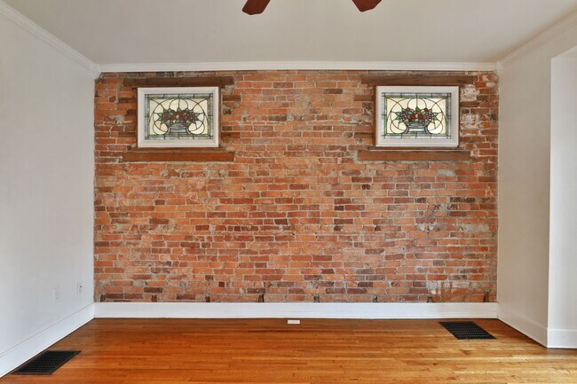 Building Photo - Charming 5-Bedroom Home with Exposed Brick and Modern Upgrades