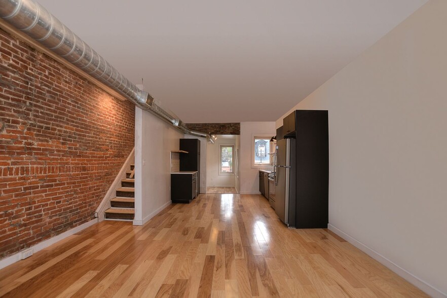 Living room looking back to kitchen/den - 1715 Locust St