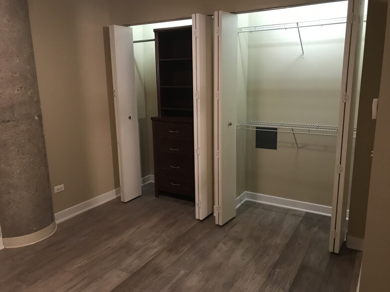 2nd bedroom closet with organizers - 320 E 21st St