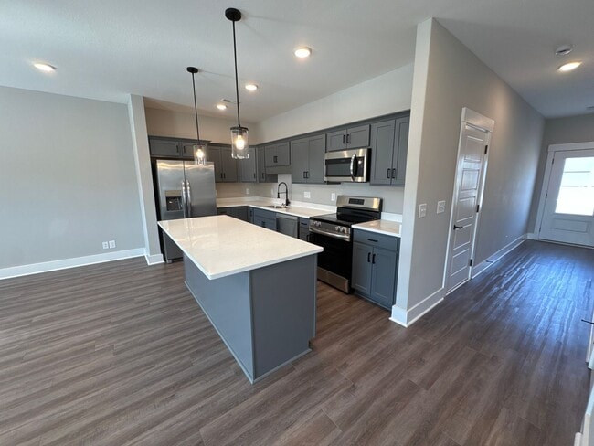 Building Photo - “Stylish 3BR End-Unit | Open Concept | Quartz Kitchen | Garage + Deck