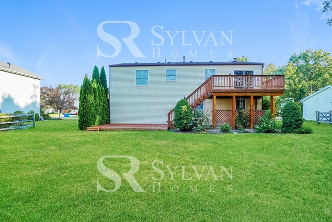 Building Photo - The living is easy in this 3 bedroom, 2.5 bathroom home