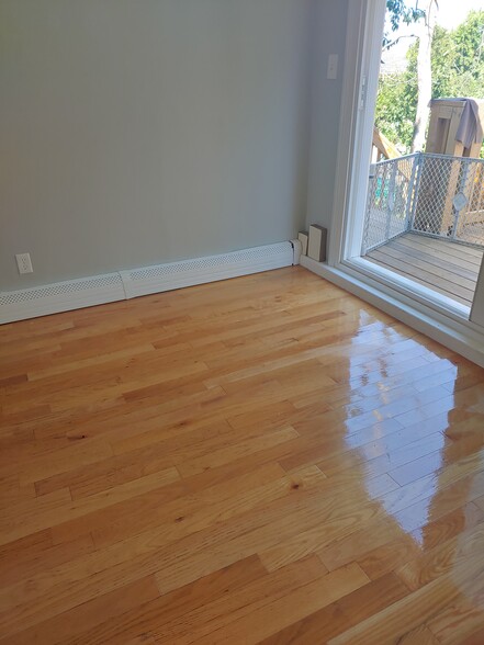 Living room with Slider to back deck ( three decks in back yard) - 623 Old West Central St