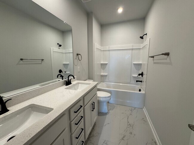 Building Photo - Spacious 1.5-Story 4BR Home with Bonus Room in Active 55+ Community