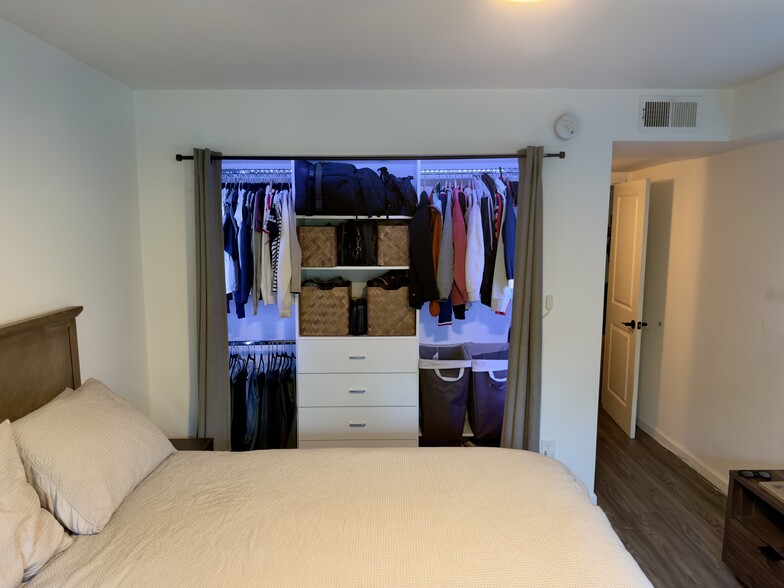 Closet with clothes and Lighting - 2700 Cahuenga Blvd E