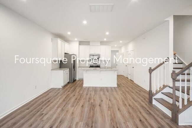 Building Photo - Spacious 3-Bed / 2.5-Bath Townhome with First-Floor Den, Hardwood Floors & 1-Car Garage – Wendell...