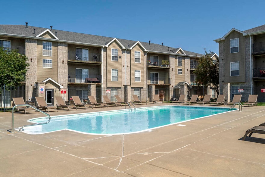 There's no better way to beat the heat than taking a dip in our refreshing swimming pool. - Eagle Run Apartments