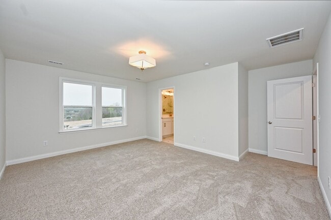 Building Photo - **BE THE LUCKY ONE TO LIVE IN THIS 2024-BUILT TOWNHOME**