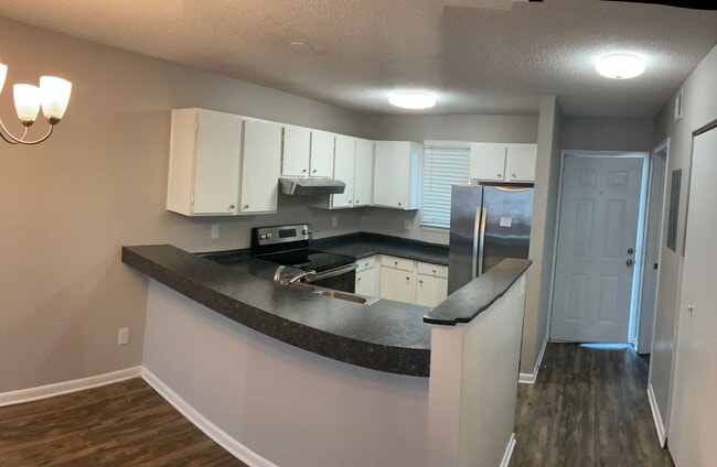 Building Photo - Just off the main road, but in walking dis...