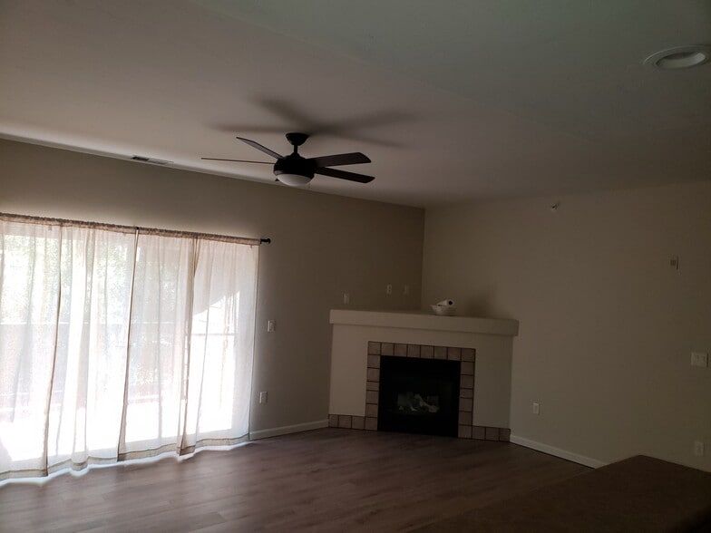 Living room w/ fireplace and deck - 2701 Midland Avenue