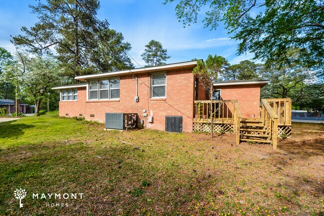 Building Photo - Charming Brick Home with Outdoor Deck