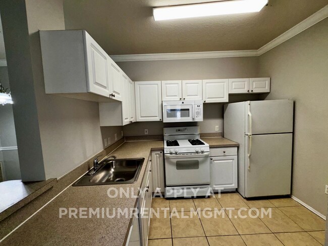 Building Photo - Spacious 2 Bed / 2 Bath Second-Floor Condo at Grand Reserve at Kirkman Park