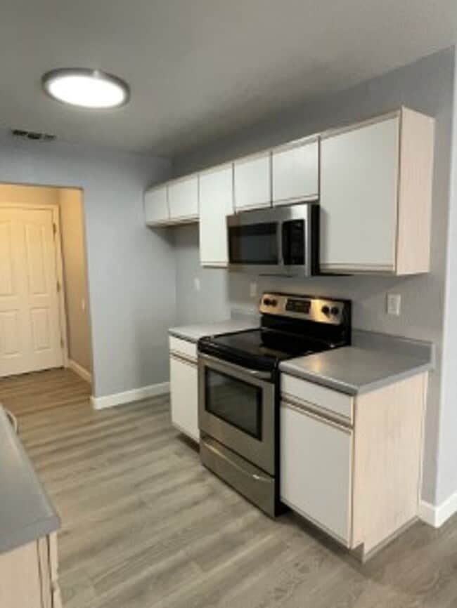 Building Photo - North side home, pet friendly with fenced back yard.